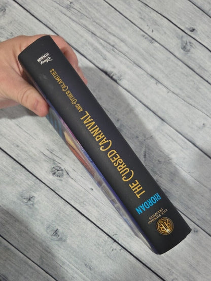 Rick Riordan Presents The Cursed Carnival and Other Calamities Hardcover